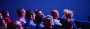 People Taking Notes at Conference